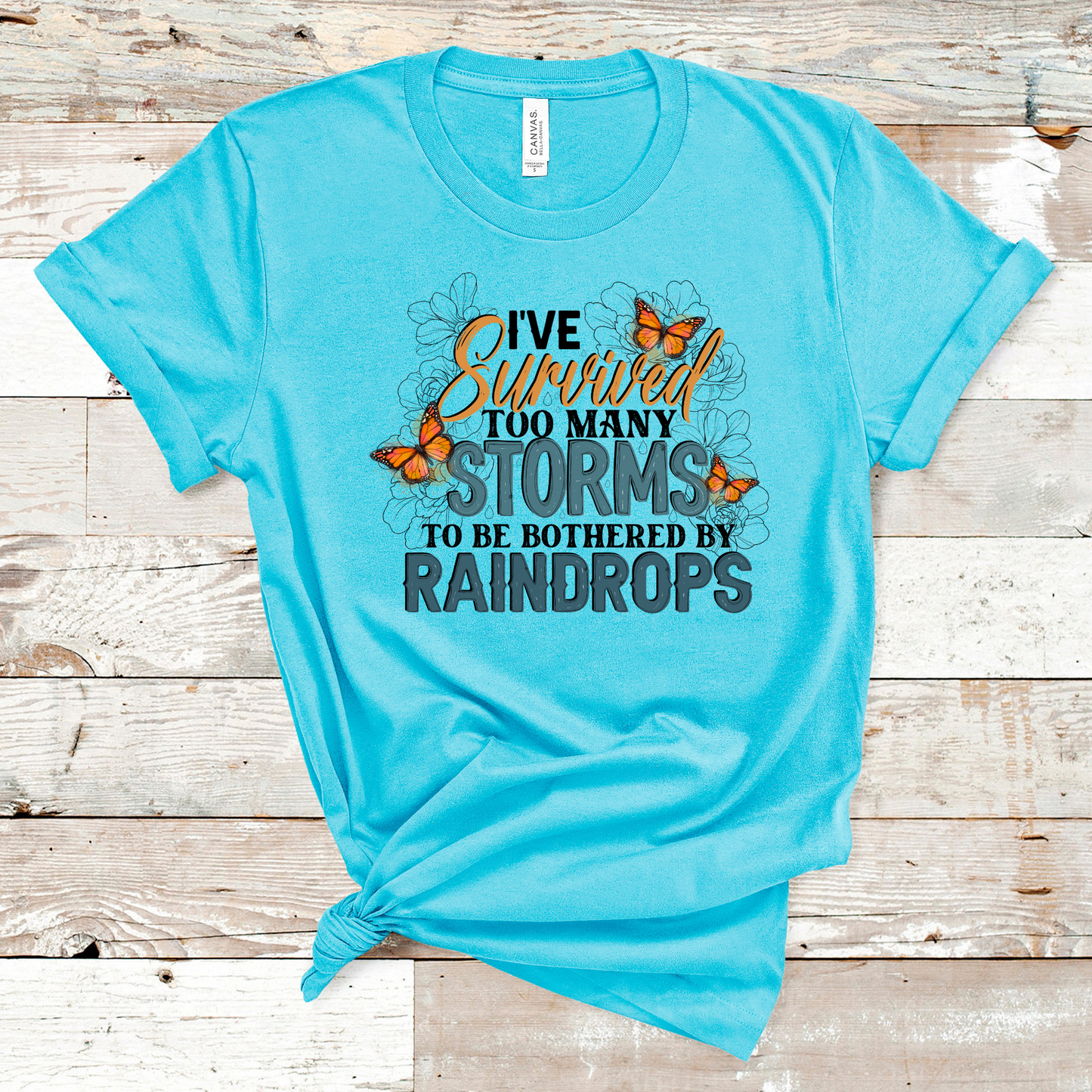 I've Survived Too Many Storms to be Bothered by Raindrops Tee